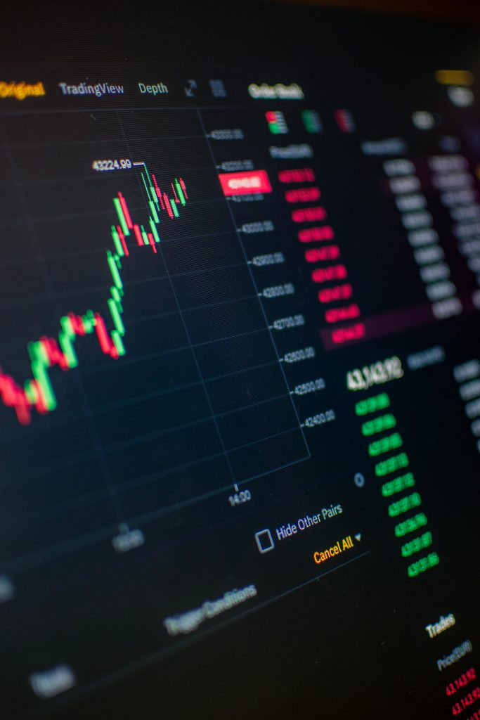 Close-up of a digital screen showing cryptocurrency market trading graph and data.