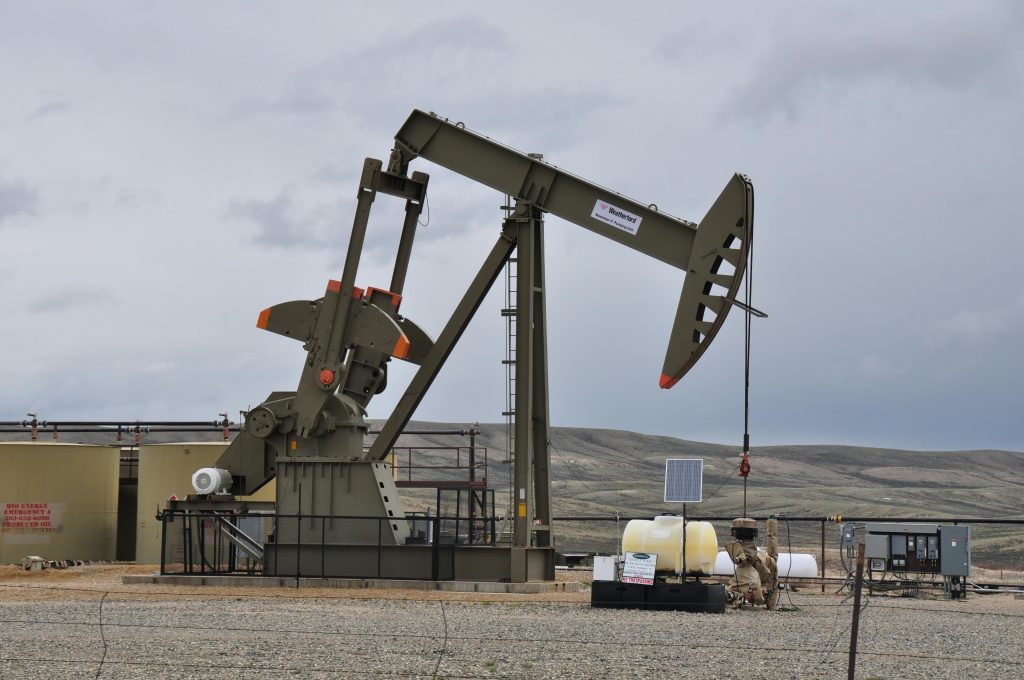 pexels photo 16852979 16852979 Oil pump jack and equipment at remote industrial site under cloudy sky.
